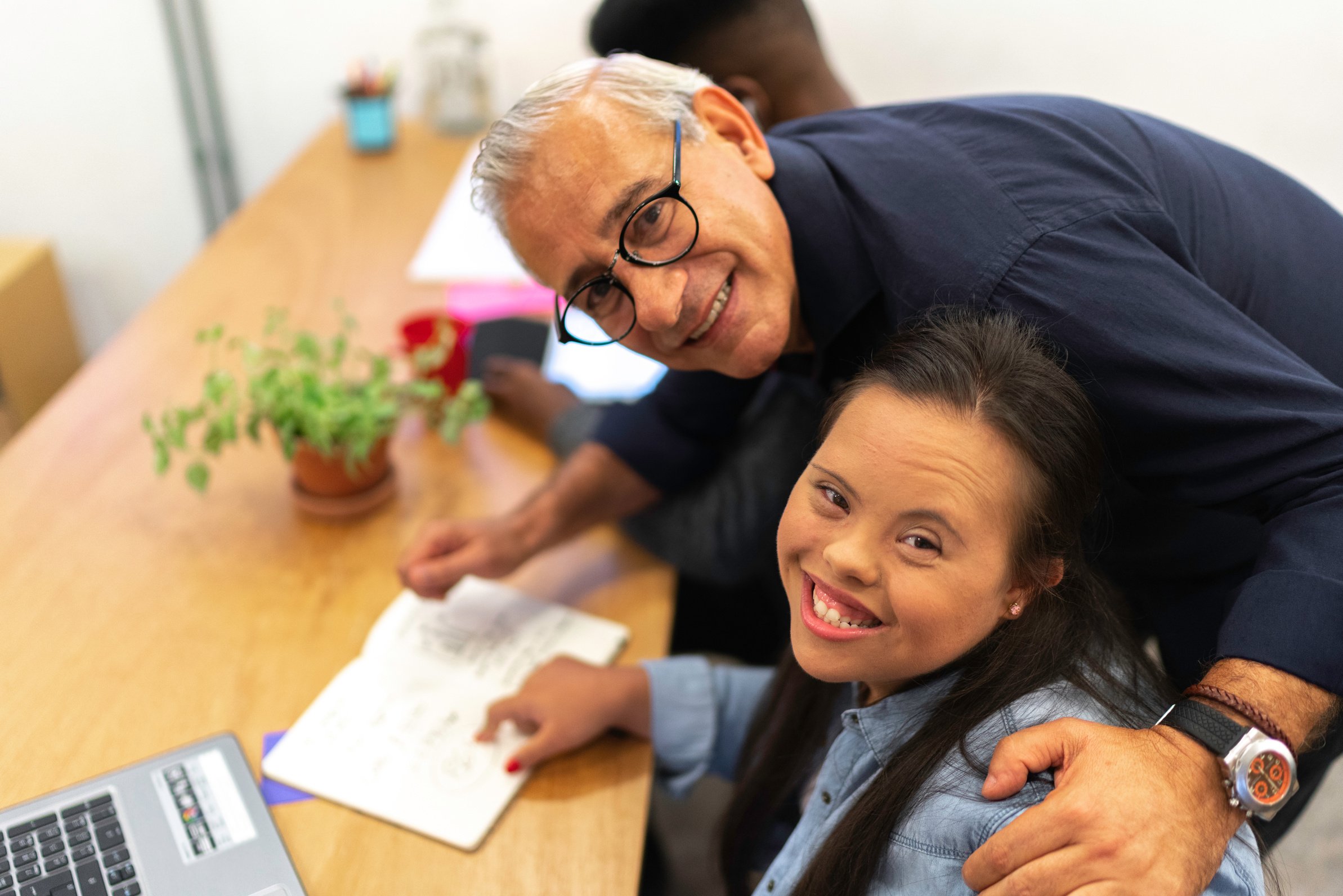 Business leadership working together with Special Needs woman - Portrait